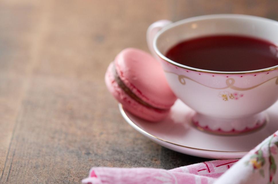 Free Image of Elegant tea cup with macaron on side 