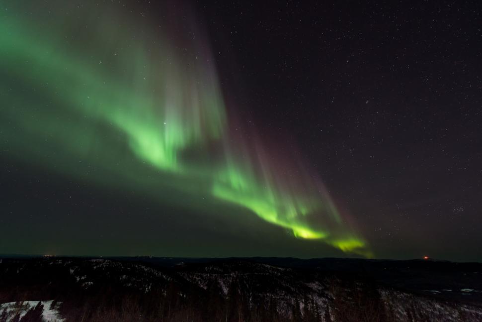 Free Image of Northern Lights dancing in the night sky 