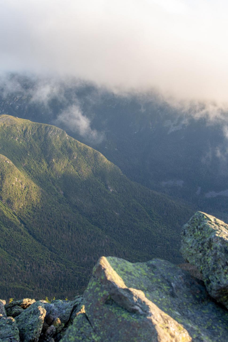 Free Image of Misty mountain landscape with cloud cover 