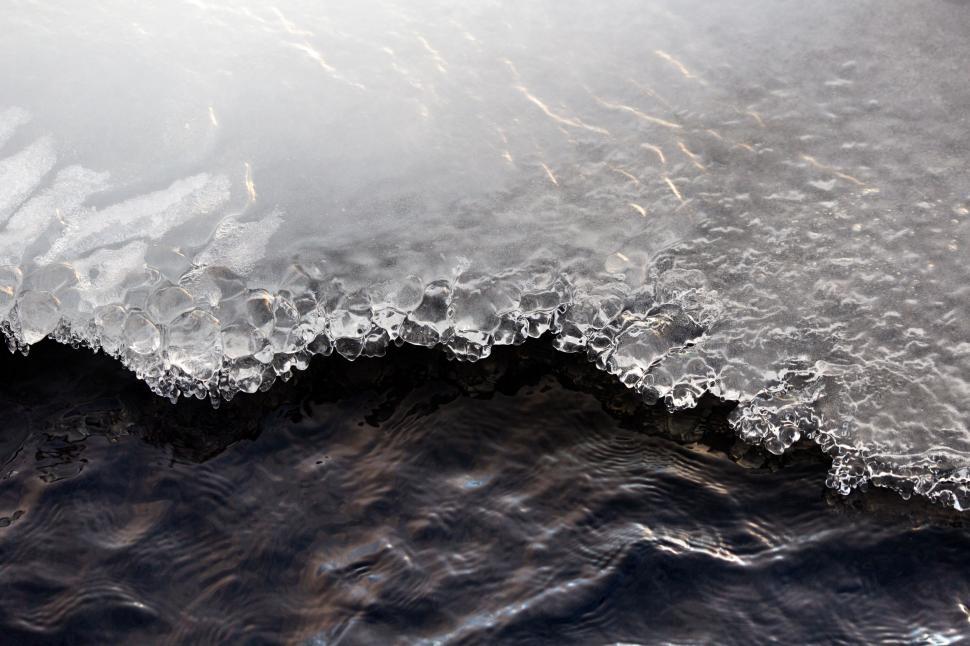 Free Image of Icy shore meeting rippling water 