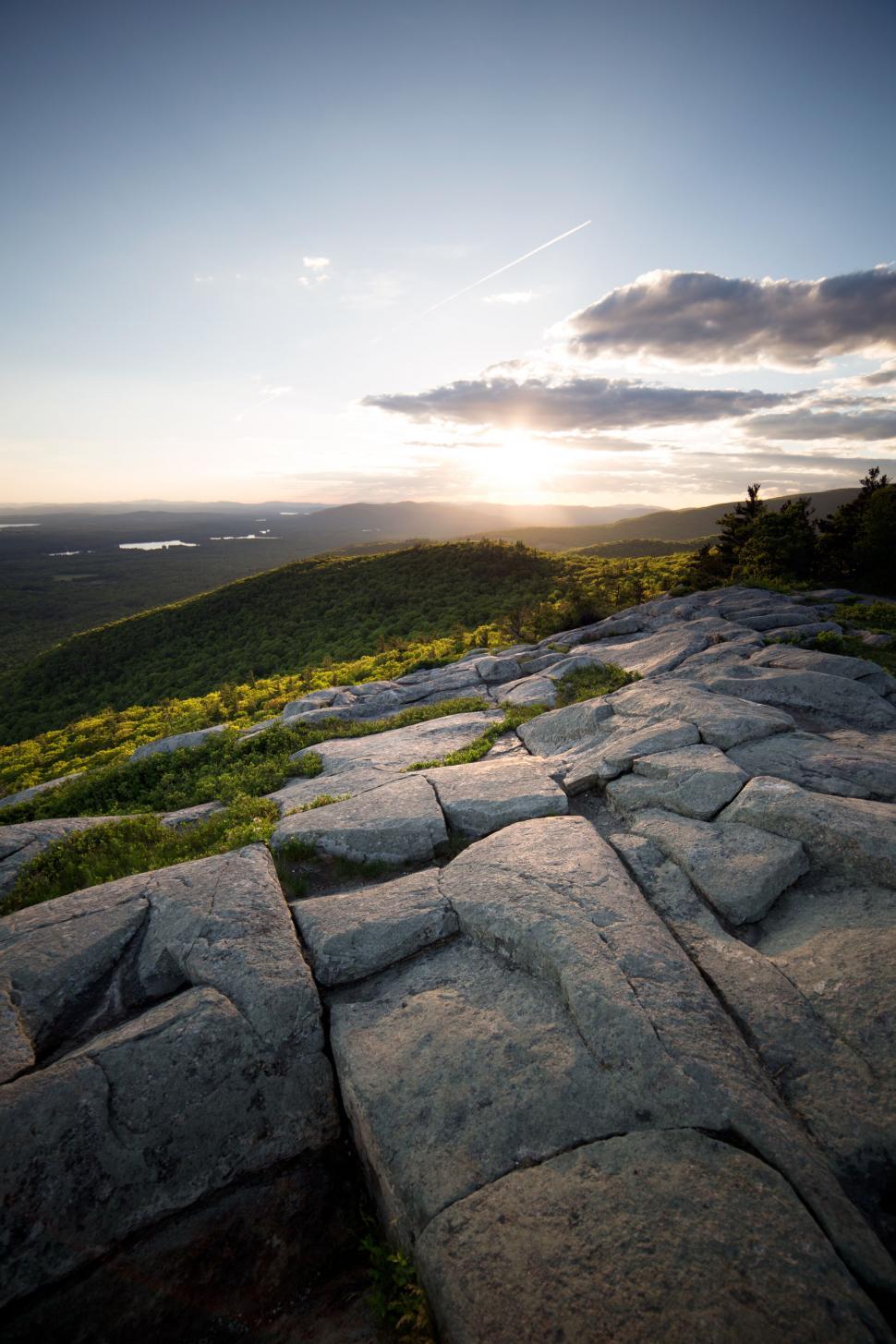 Free Image of Sunset view over rocky mountain terrain 