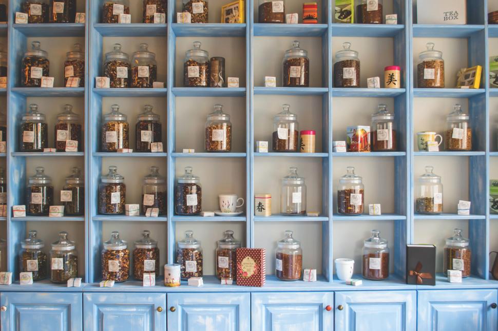 Free Image of Vintage jars on blue wooden shelves 