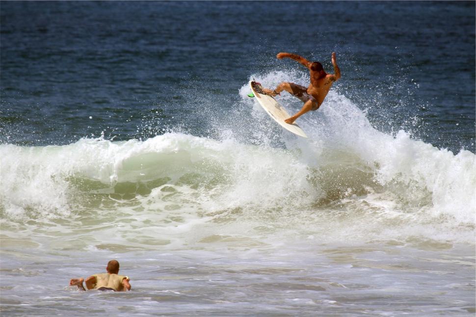 Free Image of Dynamic surfer catching a wave expertly 