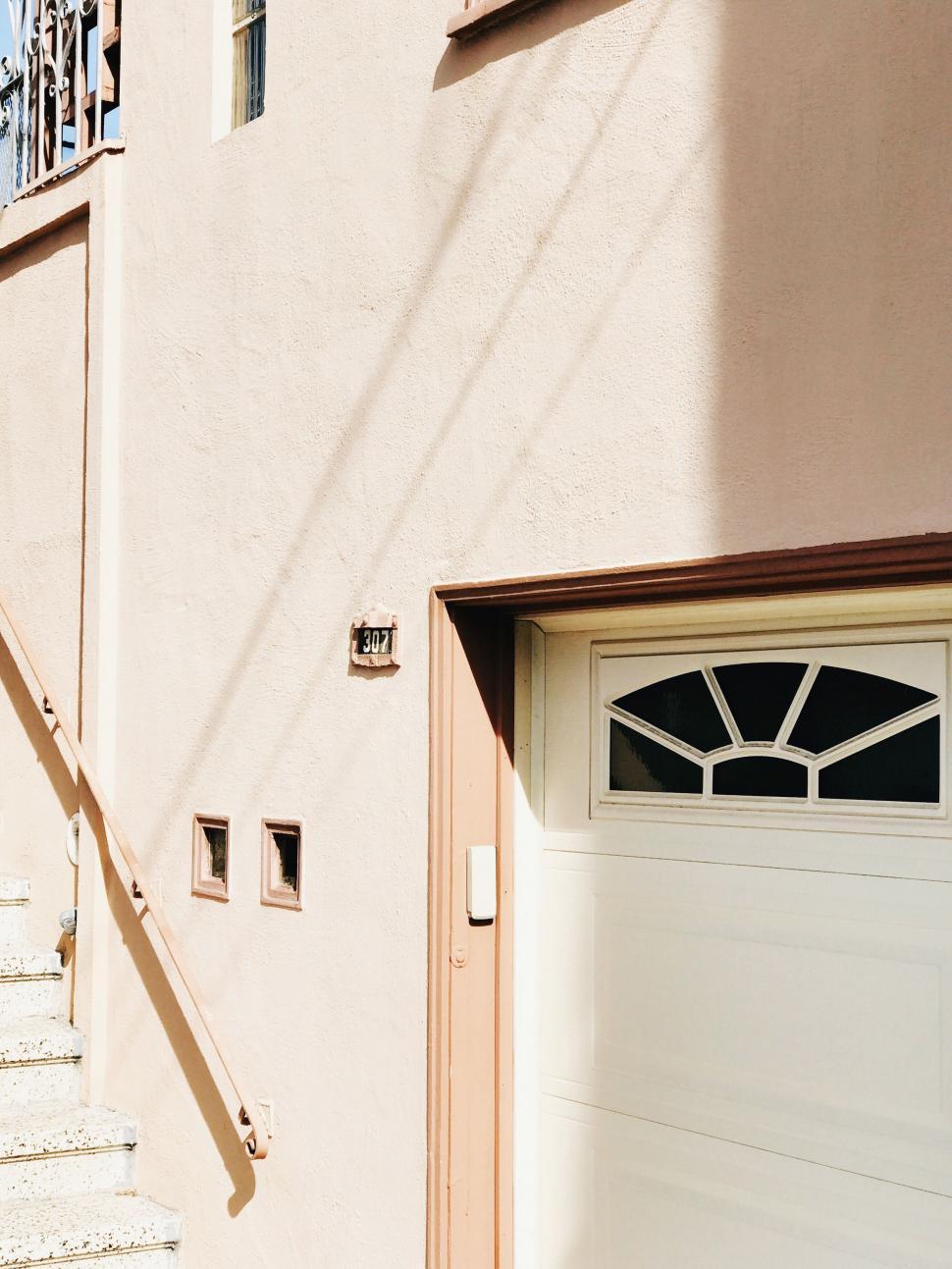 Free Image of Warm toned house facade with shadows 