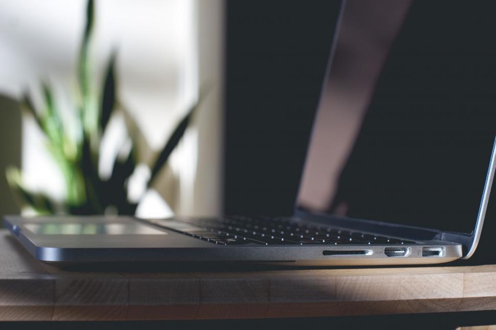 laptop-on-wooden-table-with-soft-lighting.jpg