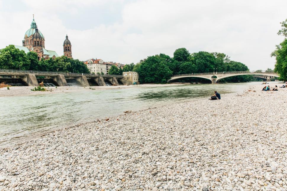 Free Image of Riverbank with a cathedral in the distance 