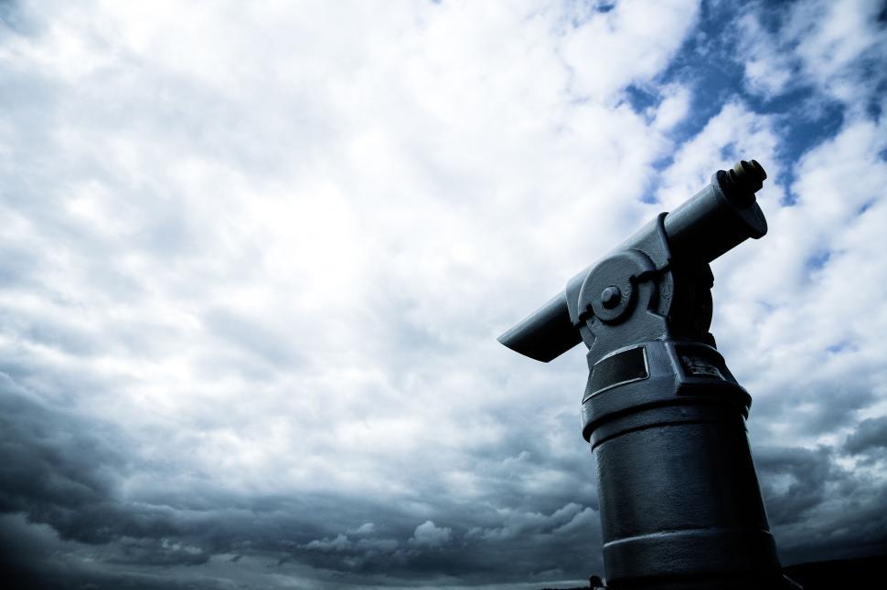 Free Image of Dramatic view of coin-operated telescope against sky 