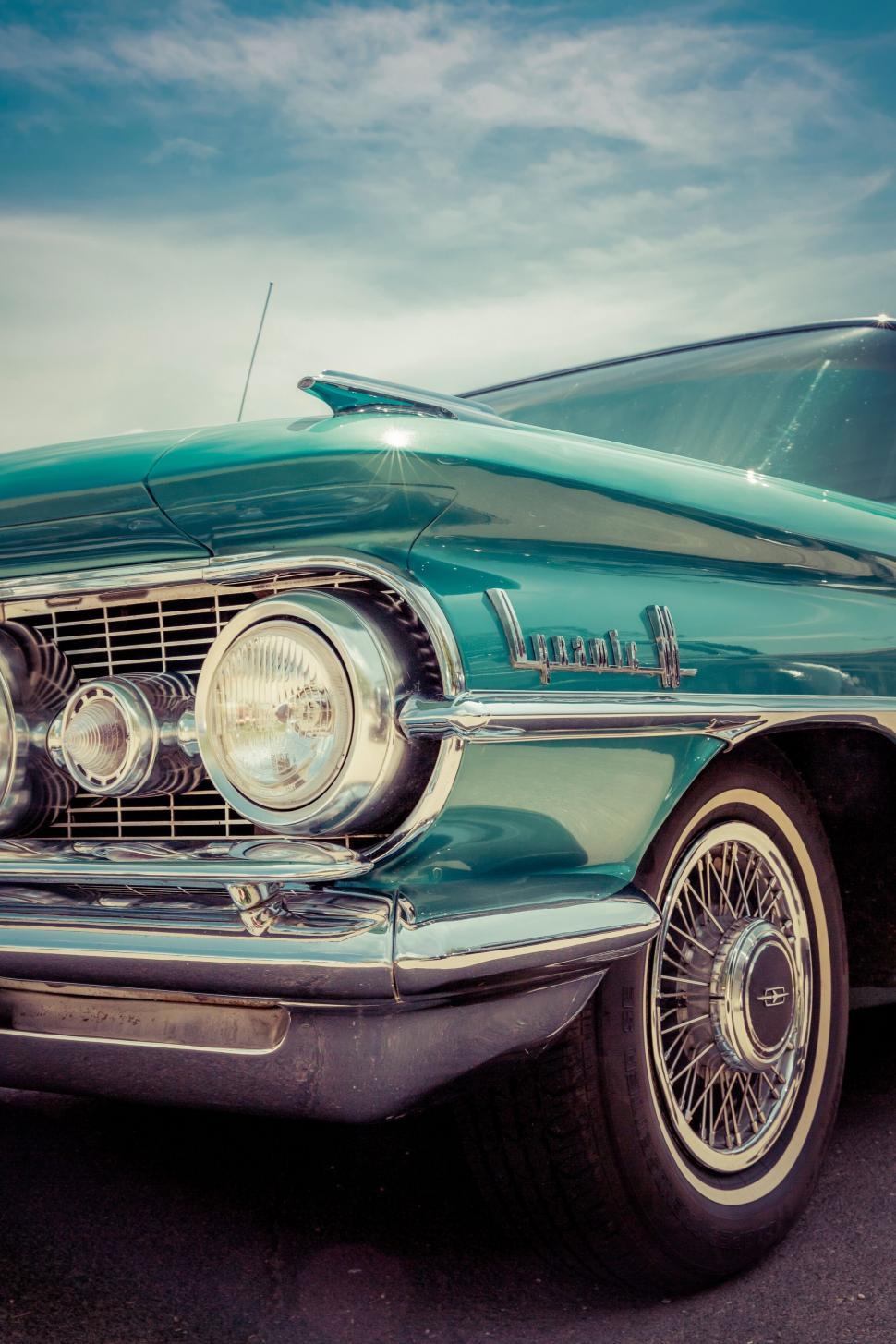 Free Image of Vintage turquoise car with stylish chrome details 