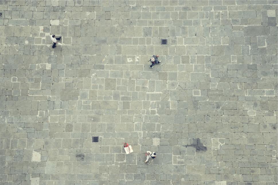 Free Image of Aerial view of people on a stone square 
