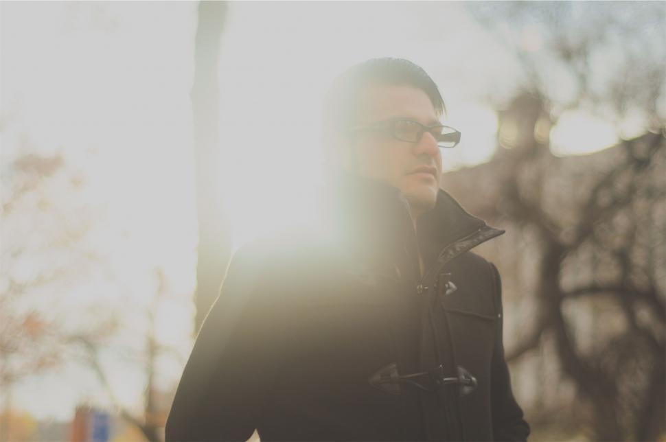 Free Image of Silhouetted person against a bright sunset 