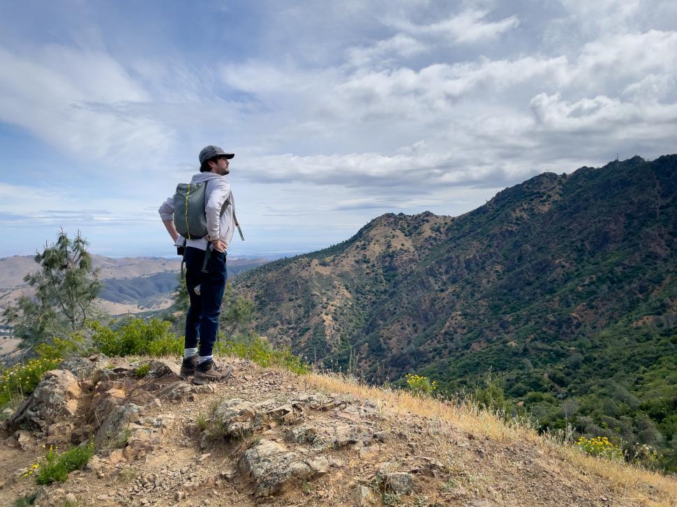 Free Image of Hiker observing a mountain landscape 