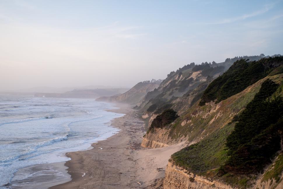 Free Image of Aerial view of ocean and rugged cliffs 