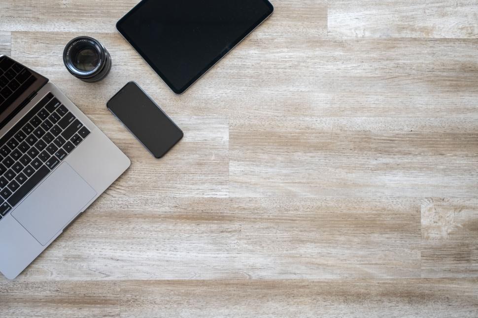 Free Image of Laptop and gadgets on a wooden desk 