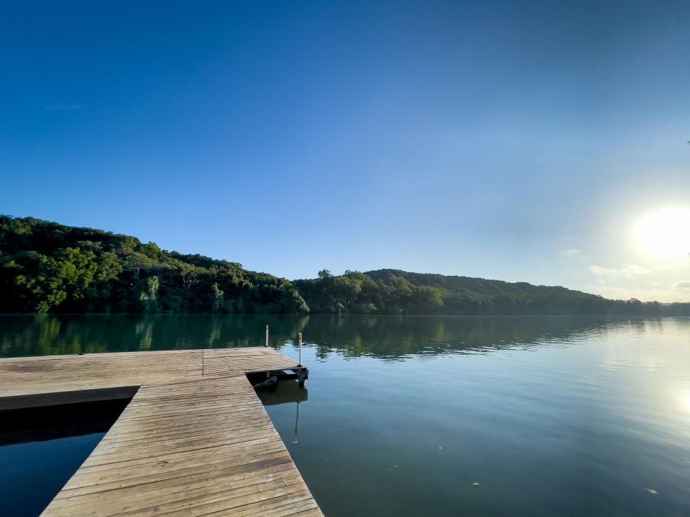 Free Image of Tranquil lake with dock at sunrise 
