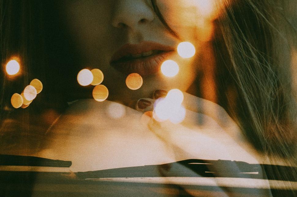 Free Image of Double exposure of woman and city lights 