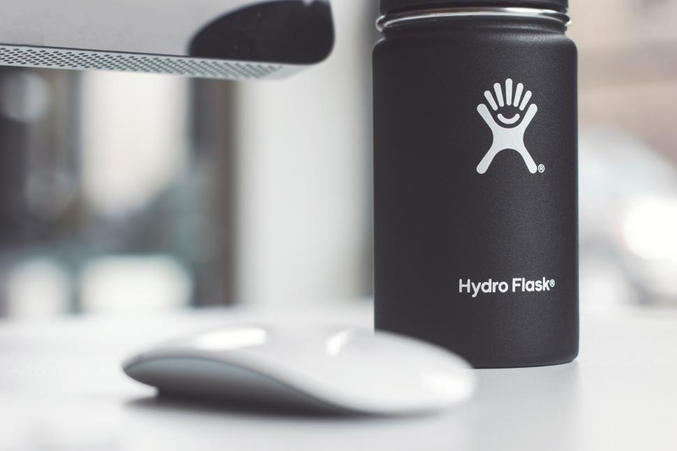 Free Image of Hydro Flask bottle near computer 