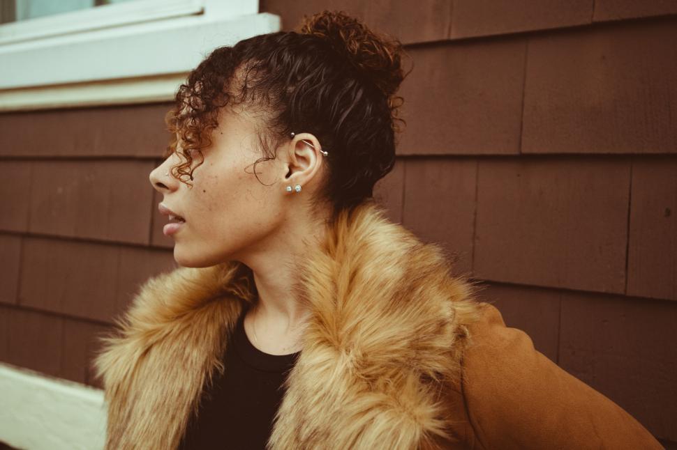 Free Image of Woman in stylish fur coat looking away 