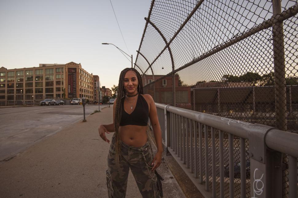 Free Image of Woman with urban backdrop at golden hour 
