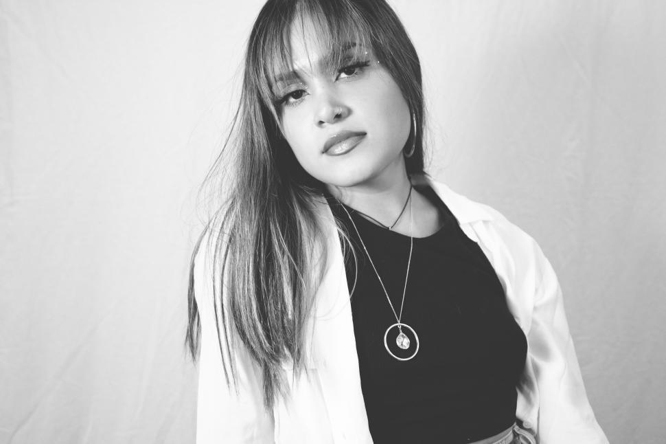 Free Image of Black and white photo of a woman posing 