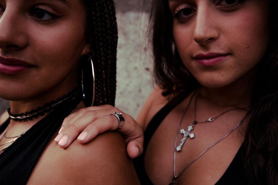 Free Image of Close-up of two friends embracing each other 
