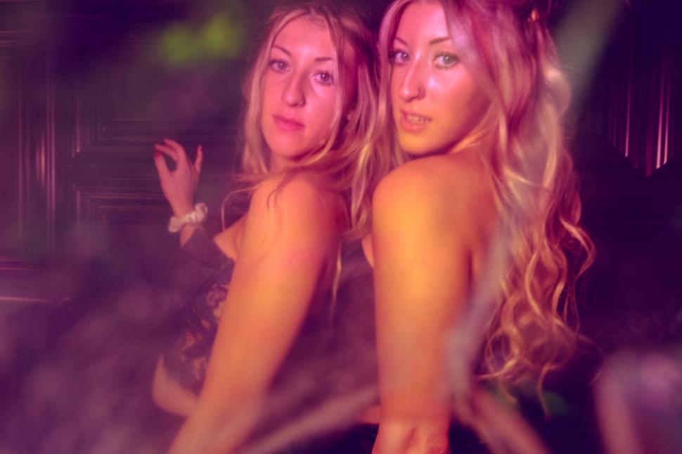 Free Image of Double exposure of women in evening ambiance 