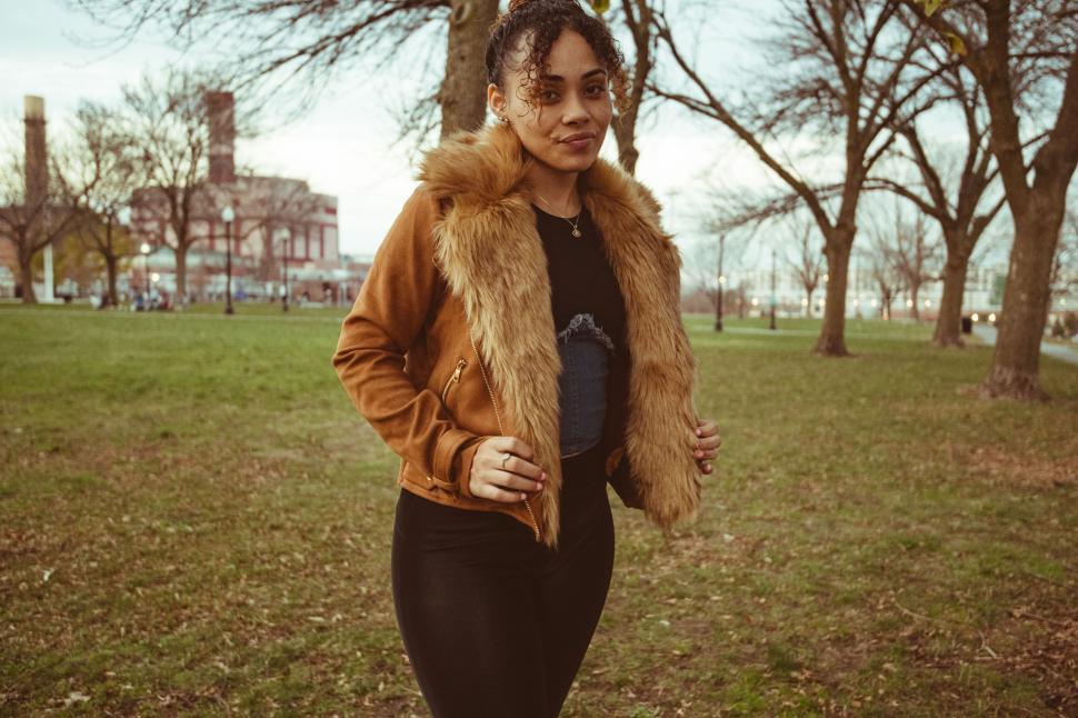 Free Image of Stylish woman walking in park 