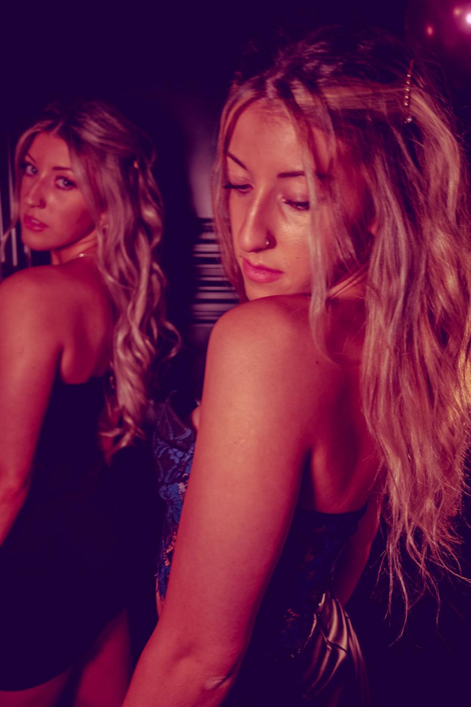 Free Image of Women in party dresses with lights 