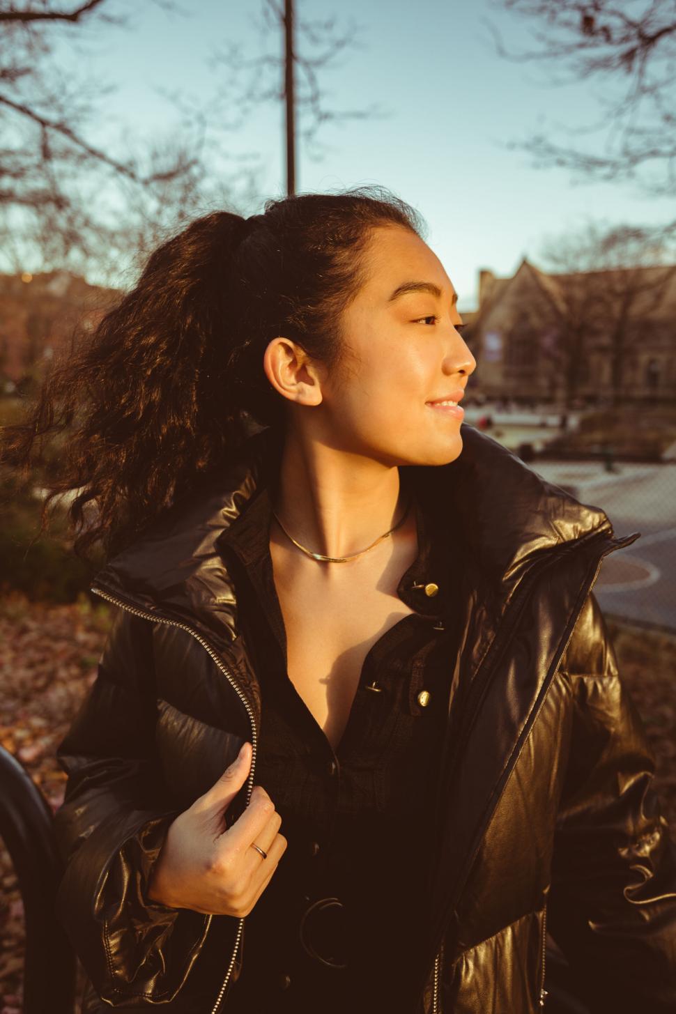 Free Image of Smiling woman enjoying the sunlight 