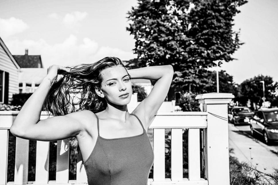 Free Image of Woman posing with hands in hair 