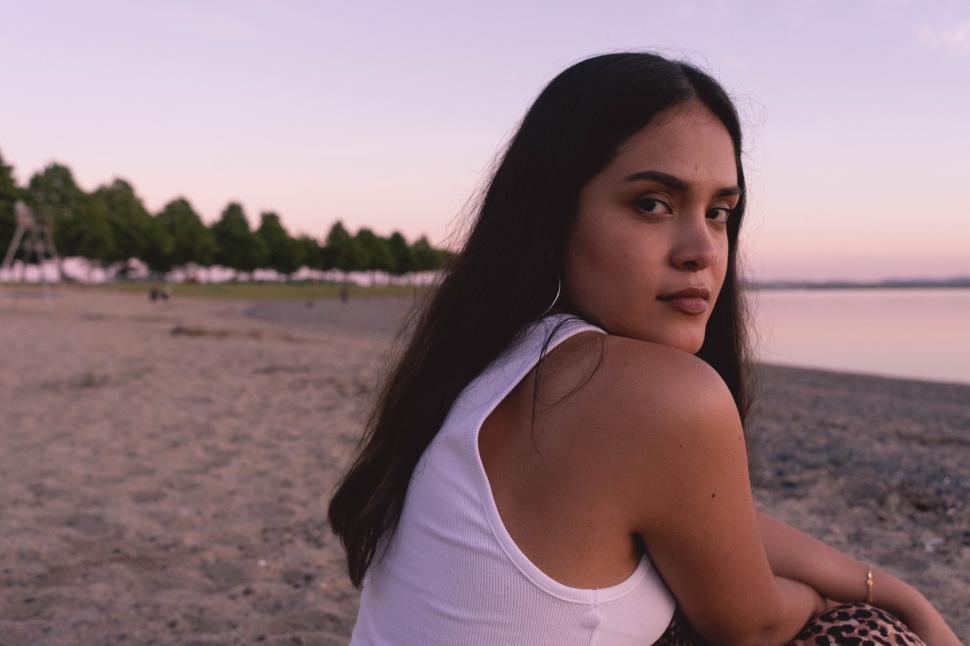 Free Image of Woman gazing reflectively at the beach 