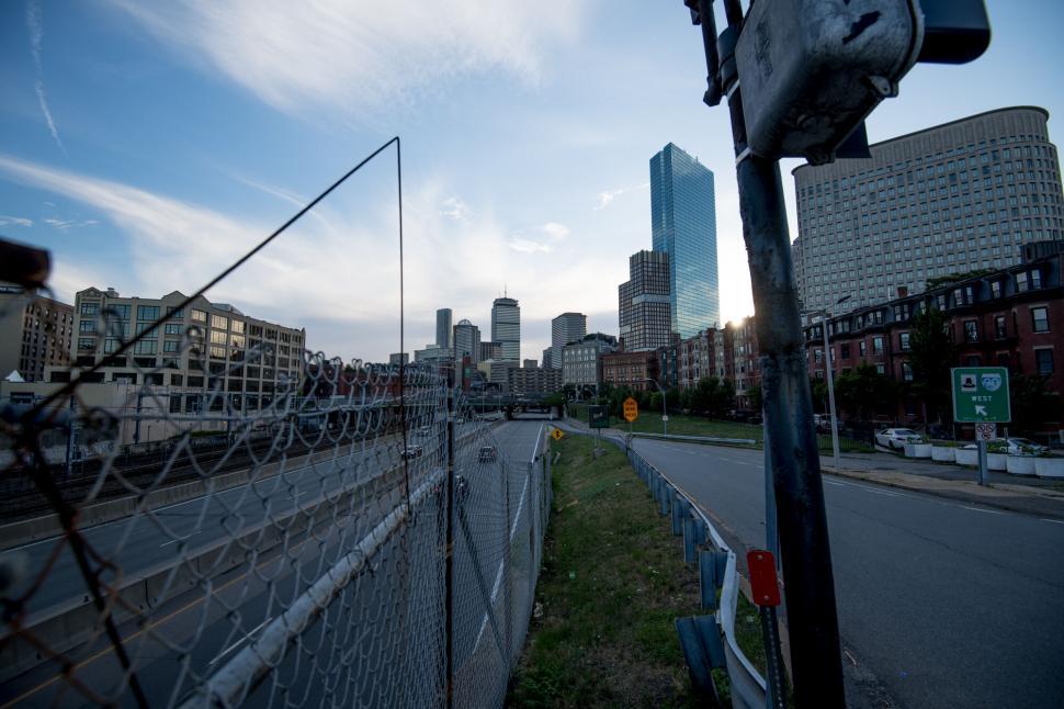 Free Image of Urban landscape with fence foreground and skyscrap 