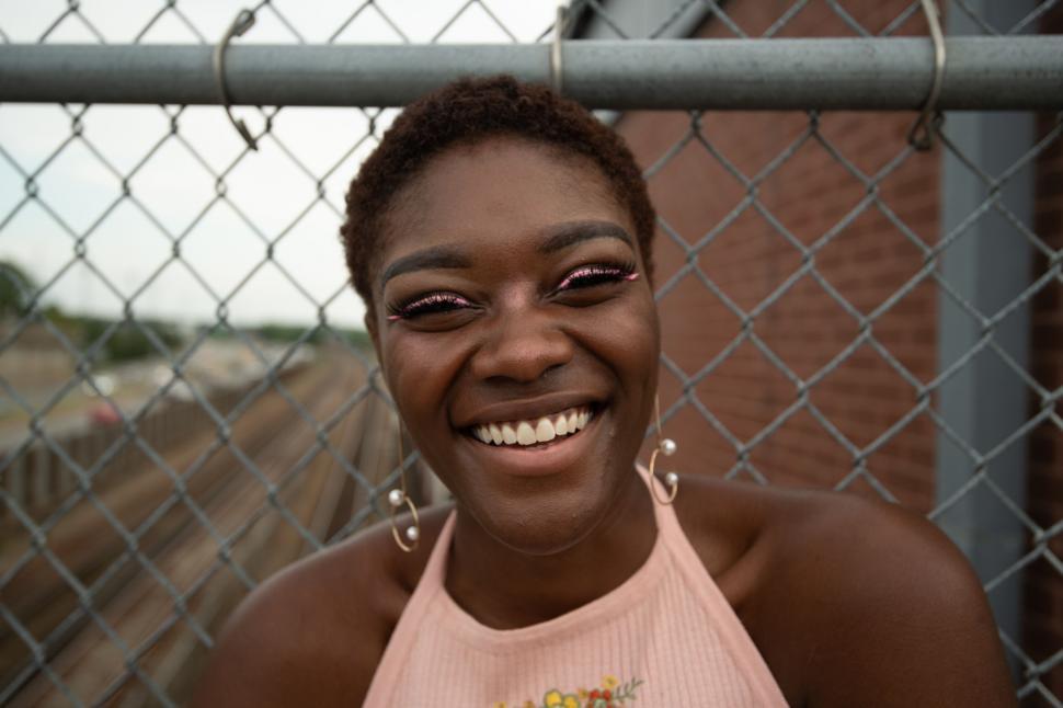 Free Stock Photo of Close-up of smiling woman with fence background ...