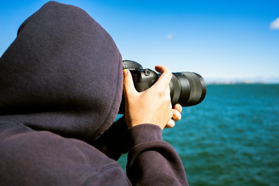 Free Stock Photo of Photographer capturing sea views with a camera ...