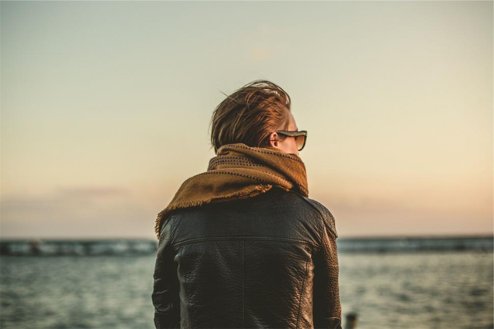 Free Image of Person gazing the sea during sunset 