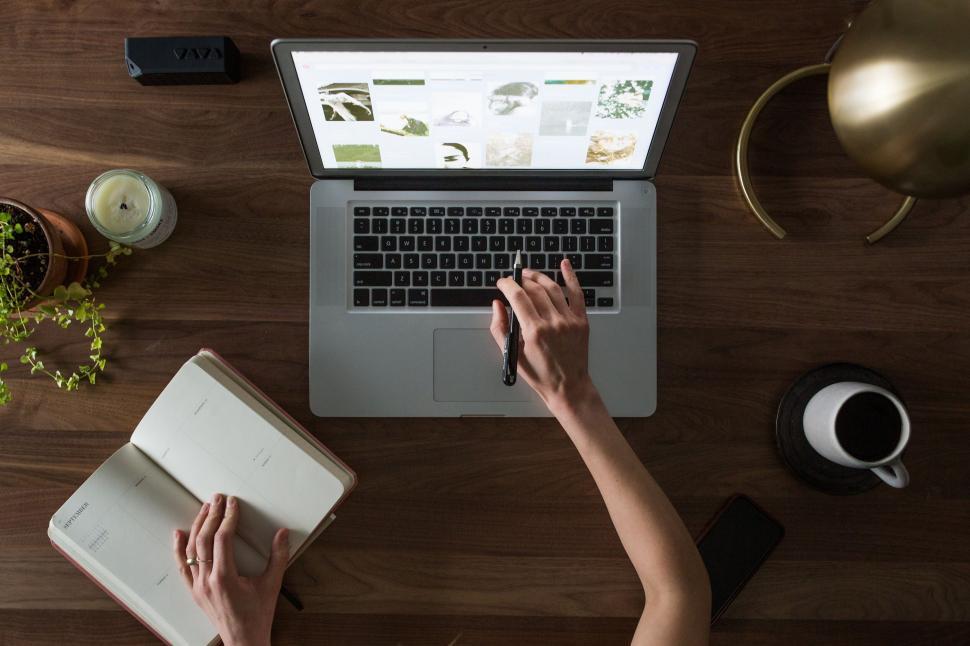 Free Image of Workspace with laptop, notebook, and VAVA speaker 