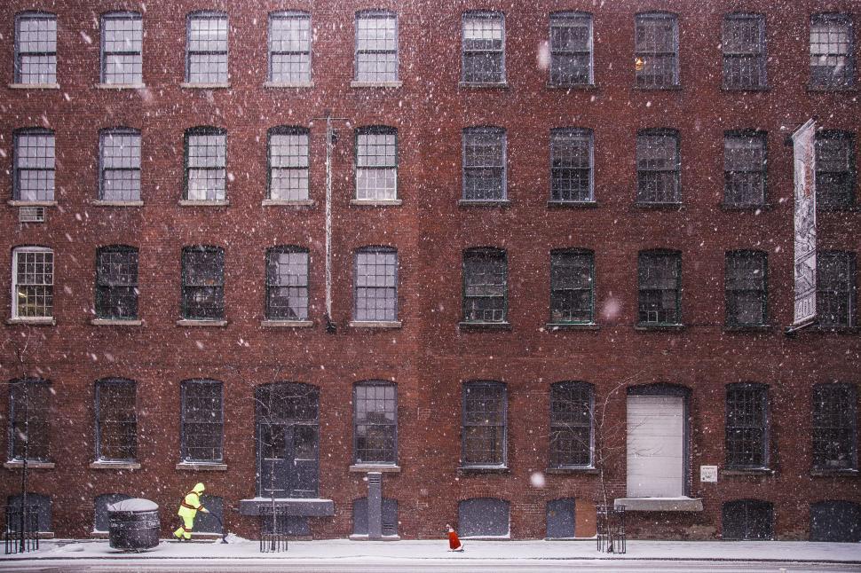 Free Image of Winter scene with a solitary figure walking 