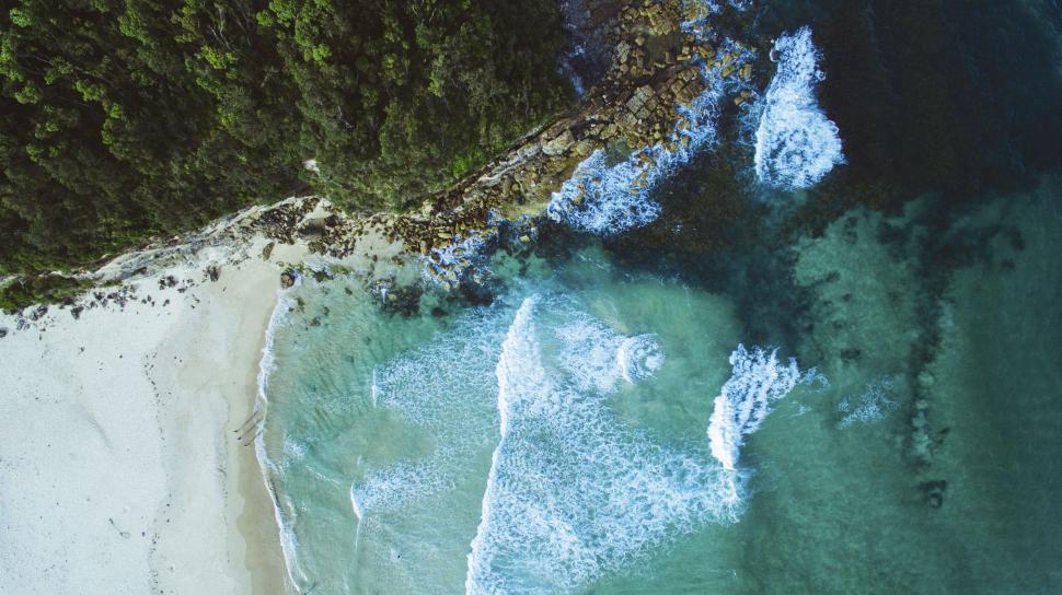 Free Image of Aerial view of beach with shoreline waves 