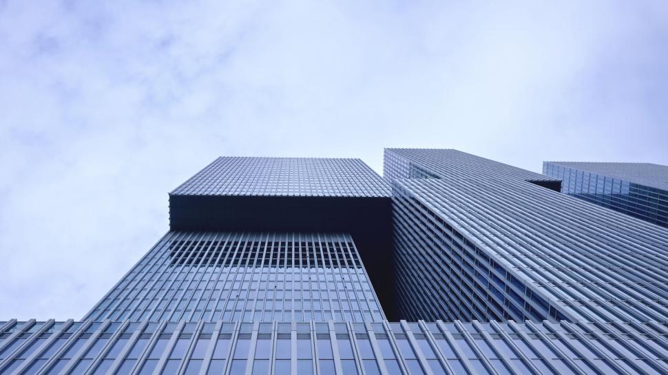 Free Image of Modern skyscraper soars into blue sky 