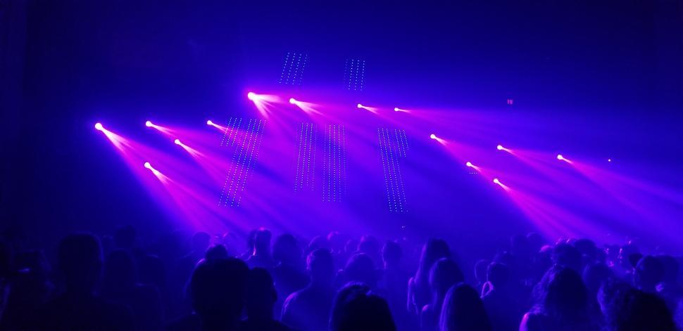 https://freerangestock.com/sample/168988/vibrant-concert-with-blue-stage-lights.jpg