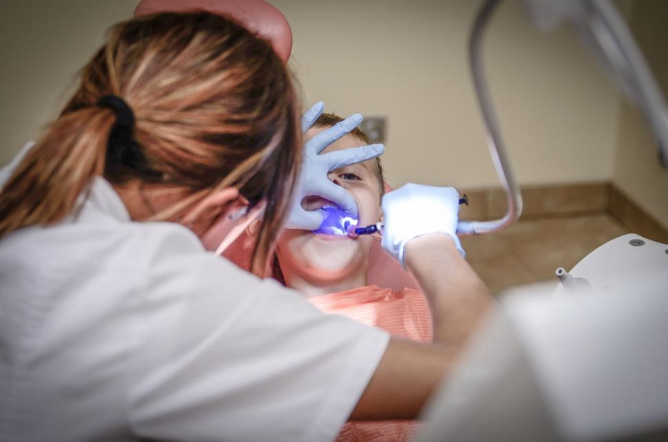 Free Image of Dentist performing procedure on patient 