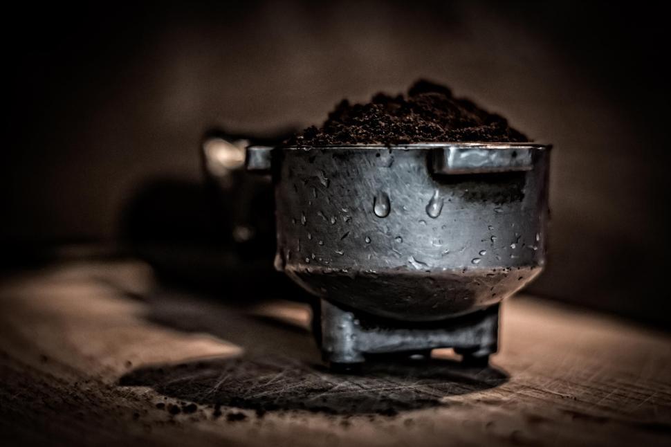 Free Image of Dark roasted coffee grounds in portafilter 