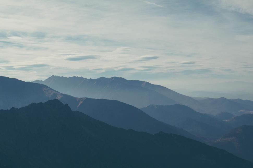 Free Image of Majestic mountain range under blue sky 