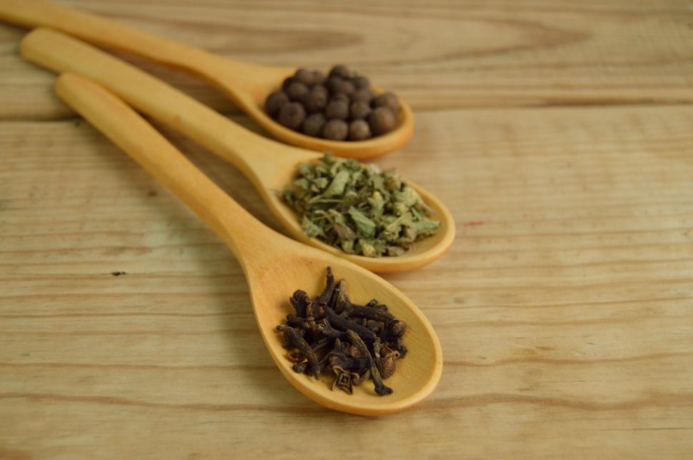 Free Image of Spices on wooden spoons on a table 