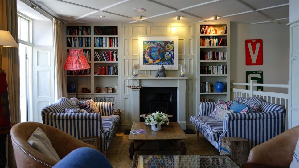 Free Image of Cozy and Colorful Living Room with Bookshelves 