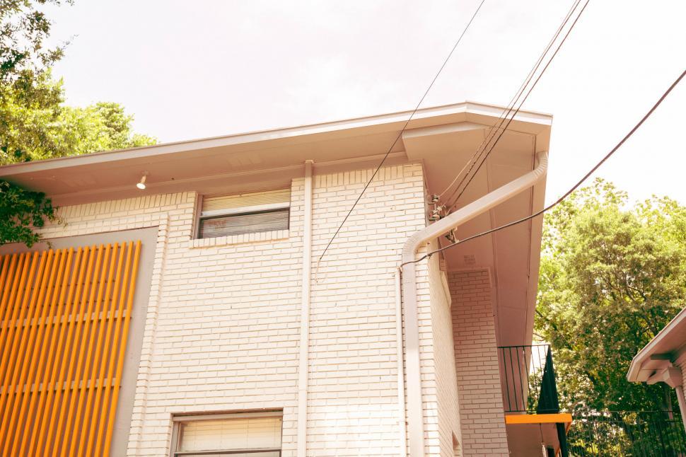Free Image of Minimalist Urban Building facade with Orange Detail 
