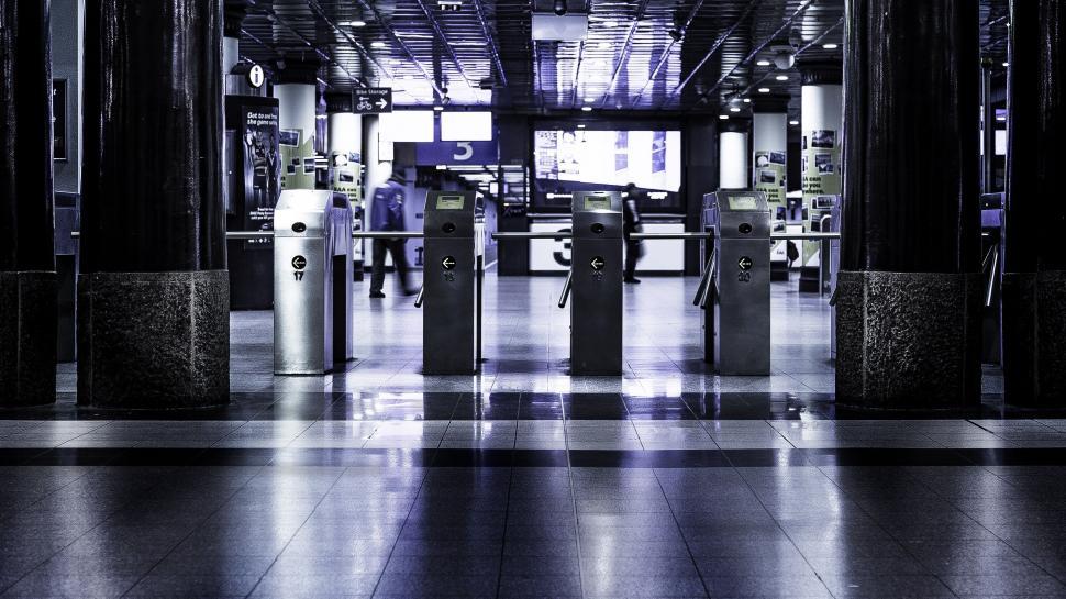 Free Image of Turnstiles at empty navy blue subway entrance 