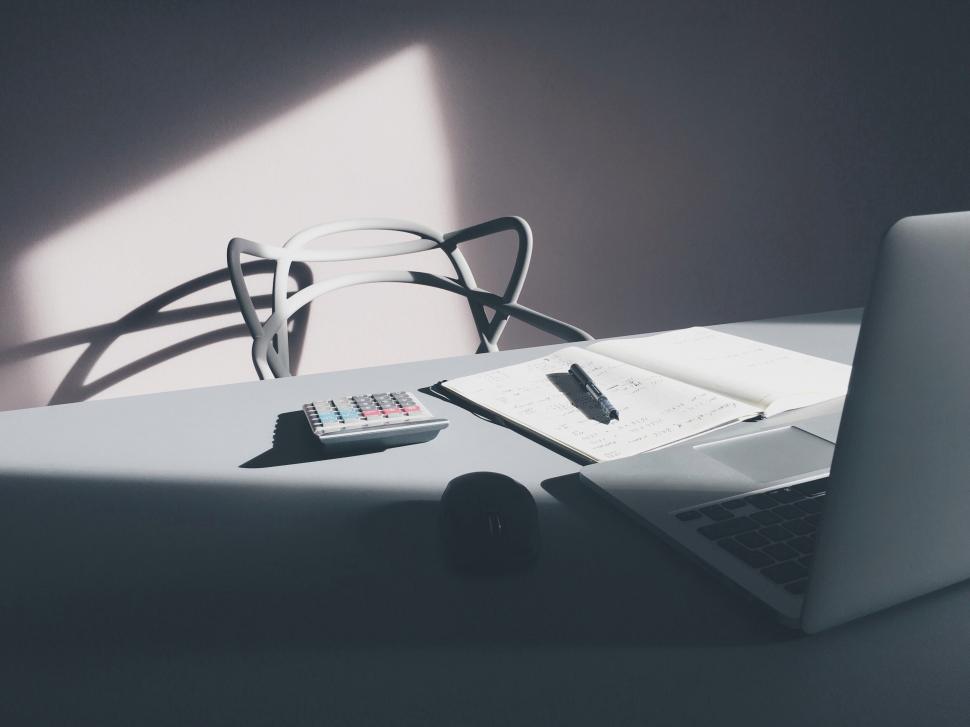 Free Image of Modern workspace with sunlight and shadows 