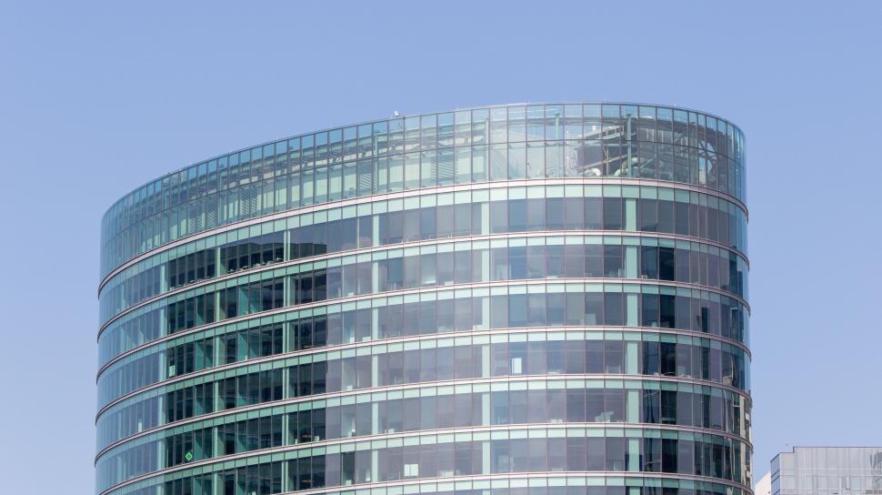 Free Image of Modern glass building facade under blue sky 