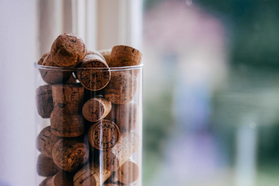 Free Image of Close-up of wine corks in a cylindrical container 