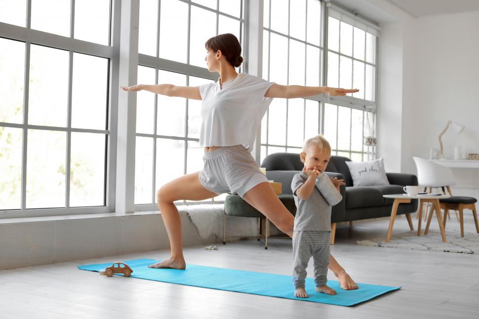 Free Image of Mother and child enjoying yoga together in home 